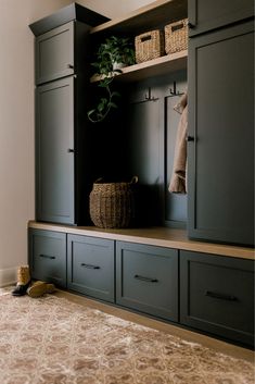 a room with some cupboards and baskets on it