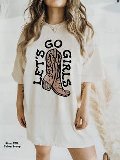 Let's Go Girls! This vintage-style western tee would be perfect for a weekend in Nashville, or for a country music concert! Size up a couple of sizes to make it a t-shirt dress 😊 ⭐️ * I T E M * I N F O* ✦ Comfort Colors Unisex Shirt ✦ 100% Ring-Spun Cotton ✦ Printed using Direct To Garment style- Inks are printed directly into the fabric. ✦ Different sizing may effect placement of final design. ✦ Colors may differ slightly due to different user monitor and screen settings. 📏 * S I Z I N G * ✦ Fall Letter Print T-shirt For Country Concerts, Casual Summer Outdoor T-shirt, Casual Summer T-shirt For Ranch, Casual White Tops For Country Events, Western Style T-shirt For Country Concerts In Spring, Graphic Print T-shirt For Summer Country Events, Western Style Oversized Tops For Summer, Oversized Western Style Tops For Summer, Fall Graphic Print T-shirt For Country Events