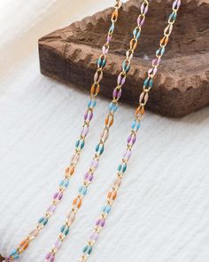 Length: 4 feet (unless otherwise listed in the drop down menu) Enamel footage chain (unfinished chain) 18k gold plated. Base: brass. Finish: 18k gold. Links measure approximately 6mm x 3mm Colors: Shades of purple/pink/blue/turquoise/orange Style ID: GP105 Suggested jump ring for permanent jewelry: JR8 - www.etsy.com/listing/1467647210 More From Our Shop  bayandstew.etsy.com New items added weekly. Stay updated on Instagram: @bayandstew About Bay & Stew Supplies We are your go to shop for hand stamping supplies, engraving supplies, permanent jewelry supplies and wholesale/bulk jewelry supplies. USA small business & female owned company. Permanent Jewelry, Orange Style, Violet Rose, Colors Shades, Rose Bleu, Orange And Turquoise, Bleu Turquoise, Orange Fashion, Blue Turquoise