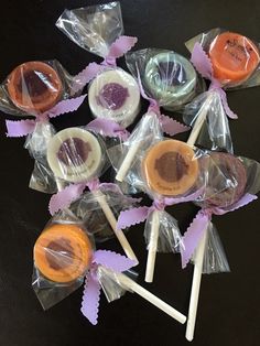 several lollipops wrapped in plastic on a table