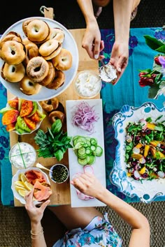 a woman sitting at a table with food on it