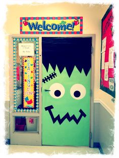 a classroom door decorated to look like a monster with the word welcome written on it