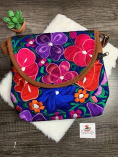 "Very cute Floral Embroidered Messenger Bag from Chiapas, Mexico Overview * Thread material * Suede material * approximate measurements: 9.5x10\" inches * handmade Care * hand wash only * delicate care * hang dry Please email me your questions before buying. All of my items come from a smoke and pet free environment. I WILL BE PROCESS YOUR ORDER IN 1-2 DAYS. If you need the item expressed shipped please contact me to request it and the listing will be adjusted to provide that option. Otherwise y Stationary Paper, Suede Material, Messenger Bags, Clothing Items, Messenger Bag, Fun Things To Do, Thread, Pet, Floral