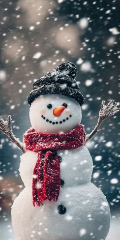 a snowman wearing a red scarf and hat