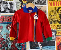 "Vintage kids 1980/90s red color block long sleeve pullover polo shirt with S.S. Seadog graphic emblem. Made of 50% polyester + 50% cotton. manufacturer | Buster Brown -- made in U.S.A. tag size | 24mo. measurements {takens laying flat}: shoulders -- 8.25\" chest -- 10\" total length -- 12\"" Retro Long Sleeve Tops For School, Retro Long Sleeve Color Block Tops, Retro Color Block Long Sleeve Tops, Retro Red Tops For Winter, Red Retro Winter Tops, 90s Red Long Sleeve Tops, Retro Red Long Sleeve Top, Red Retro Long Sleeve Top, Vintage Red Long Sleeve Top