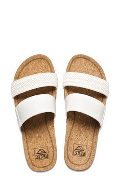 An easy slide sandal is made from Reef's supersoft, lightweight Cushion Bounce foam, with a cupped heel and arch support for comfort all day long. 1 3/4" heel; 1 1/2" platform; 1/4" slope (size 6) Cushioned footbed with arch support Synthetic upper and lining/rubber sole Imported White Slip-on Footbed Sandals With Arch Support, Comfortable White Slides With Cork-bed Midsoles, White Open Toe Flip Flops With Arch Support, Comfortable White Synthetic Footbed Sandals, Comfortable White Sandals With Cork-bed Midsoles, White Slides With Cork-bed Midsoles For Beach, White Open Toe Footbed Sandals With Ortholite Insole, Casual White Slides With Cork-bed Midsoles, Adjustable White Synthetic Slides