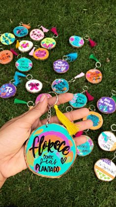 a person is holding a keychain that has been decorated with the words peace