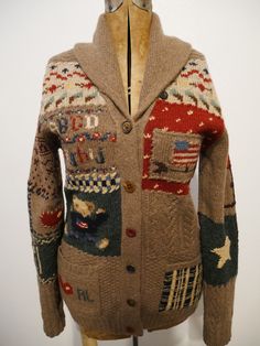 Vintage Ralph Lauren Hand Knit Sampler Sweater  Ralph Lauren cardigan  Ralph Lauren borrowed from historic antique samplers and patchwork quilt designs. Some of his favorite iconic designs like American Flag, Heart, Horseshoe, Star, Polo Bear and Equestrian themes are knit and embroidered on this work of art Lovely wooden button detail, quirky with mismatched buttons on sweater Hand Knit Blue Label Americana, Equestrian, Horse, Lucky Horseshoe, Preppy, Handcraft Women's Size Medium  Body of sweater - 100% wool Design - 84% wool, 15% silk Approximate measurements inches (laying flat): length from shoulder to bottom: 27.5 pit to pit: 18.5 sleeve from shoulder seam: 25 Chunky Jacket, Kinda Classy Kinda Hood, Bear Flag, Black And White Coat, Black Cashmere Sweater, Long Sweater Coat, Pink Cable Knit Sweater, Womens Poncho, Knit Sweater Coat