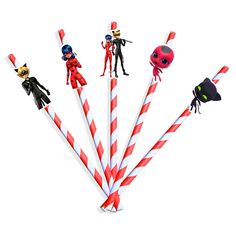 several candy canes with cartoon characters on them and one is red and white striped