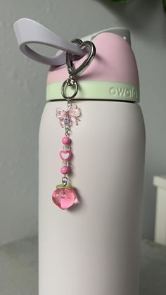 Cute pink/ clear acrylic key chain - the perfect accessory for your handbag, backpack, keys, or in this case a water bottle (owala)  The charm is held together by jewelry wire, and the heart shaped clasp makes the charm even cuter. Peach lovers rejoice, as this is the cutest peachy gift to give (or to gift yourself)  No water bottle included, only comes with the keychain. Water Bottle Accessories Owala, Owala Charm Ideas, Water Bottle Keychain, Water Bottle Charm, Owala Water Bottle Aesthetic Accessories, Owala Decoration Ideas, Water Bottle Owala, Owala Water Bottle Pink, Water Bottle Charms