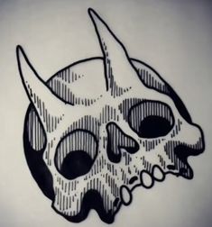 a black and white drawing of a skull