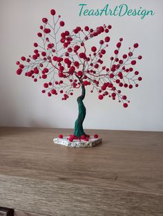 a small tree with red berries on it