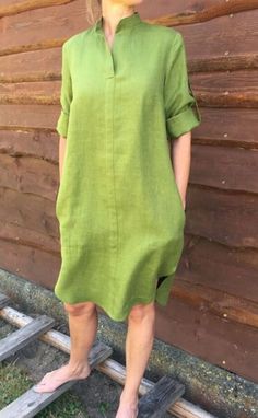 "This dress is made from soft, lightweight linen, it is designed for comfort and style. With 7/8 length sleeves and a loose fit, It's the perfect dress for any casual occasion, practical and comfortable. It has side pockets, that means you can keep your essentials close at hand while still looking chic. Check your measurements in the size chart to avoid returns of exchanges The color might be slightly different from the picture due to the light. If you have any questions about the colors, special measurements please, contact us before ordering. The above alterations make the item non-returnable and non-refundable. The model is 5′ 3″ (162 cm) tall. She is wearing an S in Moss green color. The dress length the front is 35,5\" / 90 cm. The back length 40 \"/100 cm. MATERIAL & CARE The garment Handmade Linen Dress, Dark Green Linen Dress, Casual Midi Dress With 3/4 Sleeves And Pockets, Casual Midi Dress With Pockets And 3/4 Sleeves, Oversized Solid Color Linen Dress, Linen Dress Design, Simple Linen Dress, Linen Casual Dress, Linen Loose Dress