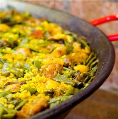 a pan filled with food sitting on top of a table