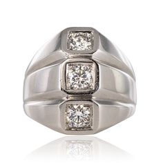 Ref. : 20-203 Ring in 750 thousandths 18K white gold, owl hallmark. Ring inspired by models by Jean Desprès, it is composed of three flat rings contiguous to each other, each set on top of a modern brilliant-cut diamond. On the back, the settings are openwork with small hearts. Total diamond weight: approximately 0.60 carat. Height: 17.9mm, Width: 16.2mm, Thickness: 5.3mm Approx, Ring Width at Base: 4.2mm. The jewel weighs: approximately 10.5 g. Authentic antique jewel - Work of the 1950s.  Our Formal Silver Diamond Signet Ring, White Gold Platinum Signet Ring With Brilliant Cut, Platinum White Gold Signet Ring With Brilliant Cut, Platinum Signet Ring In Diamond White With Brilliant Cut, Silver Diamond Signet Ring For Formal Occasions, Silver Platinum Signet Ring With Brilliant Cut, Formal Silver Signet Ring With Single Cut Diamonds, White Gold Three Stone Platinum Rings, Platinum Three Stone White Gold Rings