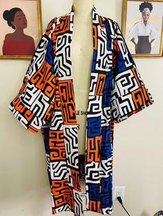 This tribal print duster kimono is made with the 100% cotton African wax  print.  It's a must have piece that can be styled in different ways, you can rock it over a fitted dress, skirt, shorts or pants.   Is a free size Black Cotton Kimono For Festivals, Summer Kimono With Abstract Print And Kimono Sleeves, Long Patterned Printed Kimono, Casual Multicolor Print Kimono, Multicolor Cotton Robe For Festival, Patterned Cotton Kimono For Festival, Cotton Patterned Kimono For Festivals, Cotton Kimono With Pattern For Festival, Casual Cotton Printed Kimono