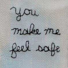 the words you make me feel souff are written on a white cloth with black thread