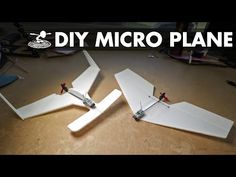 two small planes sitting on top of a wooden table with the words diy micro plane