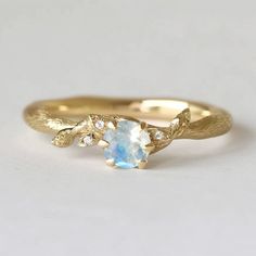 **Make a sparkling statement with this natural inspired Moonstone Engagement Ring at your next event. It's crafted in Sterling Silver, Solid Gold bands in your choice.  Gem: Moonstone, diamond *Stone Keep in mind, every piece we create is one-of-a-kind, with raw stones that differ in size, shape, and color. When ordering, anticipate some variations. Want to see your specific stone? Just send me a message, and I'll happily provide photos for you to choose from. *Metal Solid Silver/14k Gold/Rose g Nature-inspired Round Moonstone Promise Ring, Gold Moonstone Engagement Ring, Moonstone Engagement Rings, Engagement Rings Natural, Raw Moonstone, Multiple Rings, Moonstone Engagement, Solid Gold Band, Moonstone Engagement Ring