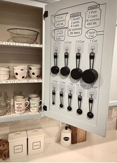 an open cabinet with lots of kitchen utensils