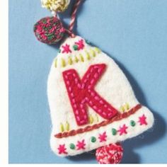 a knitted ornament with the letter k on it