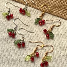 🍒Lover of cherries or just super cute food accessories? Then you're definitely in the right place! 😉 Wear these earrings to a cherry picking event, cherry blossom festival, picnic, farmers market, party, for cherry dessert baking, a trip to Door County, WI, or throw them on just for fun 🥰 They're sure to get lots of compliments! These cherry earrings are the perfect accessory for every season - spring, summer, fall, or winter! These adorable and lightweight beaded cherry earrings are 100% handmade. PLEASE HANDLE WITH CARE!❤️ MATERIALS 💎Glass E Beads 🌿Acrylic Leaf Beads 🔗Assorted Metal Findings ✨Hypoallergenic 925 Silver-Plated Copper Earring Hooks (silver or gold) 💌Clear Silicone Earring Backs (provided with each earring!) DIMENSIONS (approx, per individual earring) 📏Length - 3 cm Cherry Jewelry Diy, Fall Bead Jewelry, Cherry Beaded Earrings, Cute Jewelry To Make, Cherry Sundae, Beaded Cherry, Whimsical Earrings, Jewelry Market, Fall Bead