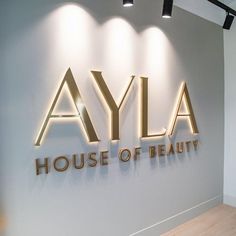 a sign that says ayla house of beauty on the side of a wall