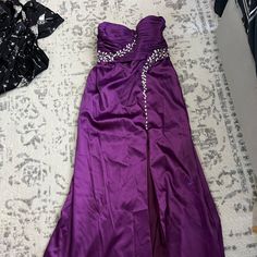 Never Worn. Excellent Condition Size 10 Evening Gown Purple Floor-length Maxi Dress For Prom, Purple Maxi Length Prom Dresses, Purple Maxi Dress With Sweep Train, Full-length Dress With Sweep Train For Homecoming, Purple Maxi Gown For Prom, Full Length Homecoming Dress With Sweep Train, Floor-length Satin Dress For Homecoming, Purple Floor-length Evening Dress, Purple Homecoming Dress With Sweep Train