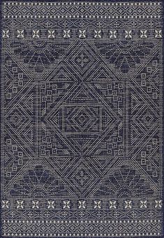 a blue and white rug with an intricate design