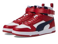 PUMA RBD Game - Men's Shoes : PUMA White/New Navy/Club Red : Add some retro flair to their wardrobe by adding the PUMA RBD Game sneakers. Leather and synthetic upper. Mesh fabric lining. Removable textile insole. Molded midsole. SoftFoam footbed. Lace-up vamp with hook-and-loop strap closure. Round perforated toe. Pull tab on the heel for easy wear. Branding detail on the tongue and heel. Synthetic treaded sole. Imported. Measurements: Weight: 1 lb Product measurements were taken using size 9, w Puma Black Sneakers, Club Red, Shoes Puma, Game Black, Gold Sneakers, White Puma, Puma White, Sneakers Puma, Black Puma