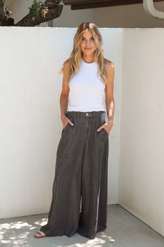 Look good and feel good in the Clarke Tencel Pants! Designed to feel like butter against your skin, these pants feature a stylish wide leg and a finished hem, offering a relaxed fit that moves with you. The Tencel fabric ensures exceptional comfort and a cooling sensation, making them perfect for those hot summer days. Malibu Collection FIT Easy Relaxed Fit Stretchy Waistband Pockets Zipper Fly Pockets Finished Hem Britt is 5'9 Wearing Size Small SIZE SMALL MEDIUM LARGE LENGTH 39" Long 40" Long Tencel Pants, Tencel Fabric, 11 11, Hot Summer, Summer Days, Your Skin, Vintage Black, Feel Like, Stylish Outfits