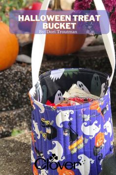 a halloween treat bucket filled with candy