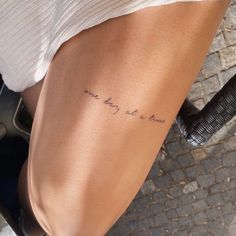 a woman with a tattoo on her leg that says, i love you to the moon and back