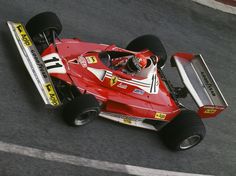 a man driving a racing car on a race track