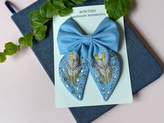 Introducing our Hand-Embroidered Cotton Hair Bows for Girls, the perfect accessory to enhance any hairstyle! These beautiful bows are 100% natural and made with love and precision. Each bow is carefully hand-embroidered with delicate flowers, creating a stunning design that adds a touch of sweetness to any look. Available in a vibrant blue color, these hair bows are the perfect choice for a stylish and cute back-to-school look. - Made by BowTiesSE: Our Hand-Embroidered Cotton Hair Bows are craft Embroidered Hair Accessories, Back To School Hair, Hair Bows For Girls, Baby Silhouette, Cotton Hair, Bows For Girls, School Hair, Pretty Rose, Bows Hair