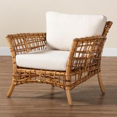 a wicker chair sitting on top of a hard wood floor next to a wall