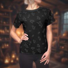 Show off your love for feline friends with our Women's Black Cat Pattern T-Shirt. This playful tee features an adorable black cat pattern, adding whimsy to your everyday wardrobe. Crafted from durable polyester, it ensures all-day comfort and breathability. The flattering cut complements your silhouette, making it perfect with jeans, skirts, or shorts. Features: Charming Black Cat Design Durable Polyester Fabric Flattering Fit Versatile for Casual Outings or Work Easy Care: Machine washable Add playful charm to your collection--order yours today! Black Relaxed Fit Top With Cat Design, Black Cat Pattern, Black Cat Design, Black Cat Tee Shirts, Spooky Black T-shirt With Cat Print, Black Relaxed Fit T-shirt With Cat Print, Playful Cotton Cat Print T-shirt, Halloween Tshirt, Cat Pattern