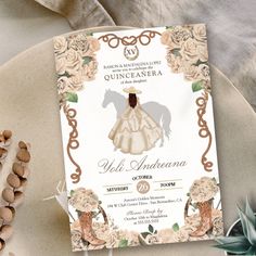 the wedding card is sitting on top of a plate with flowers and nuts around it