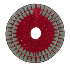 a red and green christmas wreath with silver stars on the center, in front of a white background