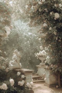 a statue sitting on top of a stone bench in a garden next to white flowers