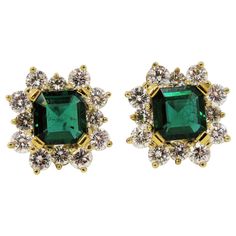 Absolutely incredible vintage-inspired emerald and diamond halo stud earrings. These eye-catching earrings give off major Old Hollywood glamour vibes with their striking green color and exquisite detail. The semi-rounded diamond halo gently softens the look while adding extra sparkle and elegance to the unique pair. These stunning earrings each feature a single emerald stone surrounded by a glittering halo of accent diamonds. The rich, vibrant green emerald stone has a square emerald cut and is Halo Diamond Earrings, Halo Stud Earrings, Halo Earrings, Halo Earrings Studs, Star Jewelry, Old Hollywood Glamour, Emerald Stone, Emerald Cut Diamonds, Stunning Earrings