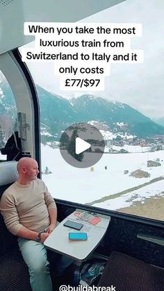 a man sitting at a table in front of a window with the words when you take the most luxurious train from switzerland to italy and it only cost