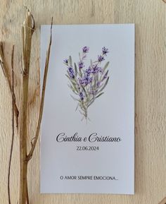 the wedding program is displayed with dried flowers