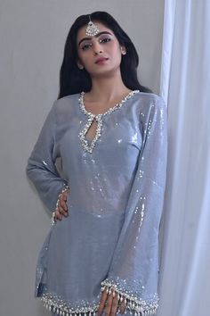 Grey short kurta with a sequin embellished base highlighted by placed pearl and jewel detail. Comes with matching sequined bell bottom pant and dupatta. - Aza Fashions Sequins Kurta Women, Festive Embellished Tops, Eid Party Top With Mirror Work, Eid Semi-stitched Sequined Kurta, Semi-stitched Sequin Straight Kurta, Semi-stitched Embellished Georgette Kurta, Blue Semi-stitched Kurta With Cutdana, Grey Kurta, Short Kurta