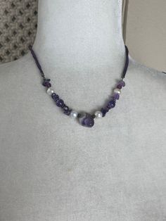 Description: Cool purple boho amethyst necklace with genuine pearl and leather straps. has lobster clasp and 2 inch adjustable chain. Label: none Size: measures 16-18" long Material: amethyst stones, genuine pearls, pewter tone hardware, suede leather strap Condition: Excellent vintage condition, no flaws, ready to wear. * I SHIP DAILY* Adjustable Amethyst Beaded Necklace In Lavender, Handmade Lavender Beaded Necklaces, Handmade Adjustable Lavender Beaded Necklaces, Adjustable Lavender Beaded Necklaces, Adjustable Lavender Bohemian Jewelry, Adjustable Bohemian Lavender Jewelry, Vintage Purple Necklaces For Festival, Vintage Purple Jewelry For Festival, Bohemian Purple Necklace With Lobster Clasp