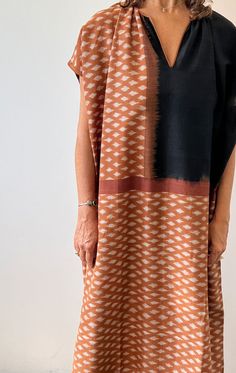 A longer caftan in gorgeous terracotta Ikat with black trim.  This is a mid weight hand woven cotton fabric with opaque coverage. A perfect piece to be worn on its own as a dress or as a fabulous coverup for the beach. Custom fabric design by Two Ikat weave Hand spun cotton Length 49"  Width 33" Kantha Jacket, Boho Beachy, Mid Dresses, Woven Cotton, Black Trim, Hand Spinning, Sewing Inspiration, Simple Dresses, Cotton Weaving