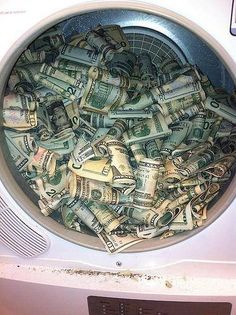 a washing machine filled with money in it's front door and the words bill gates pocket change fell out in the dryer again whoops