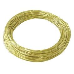 a coil of gold colored wire on a white background