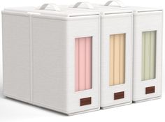 three white boxes with different colored stripes on them