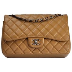 This Chanel Double Flap Bag is made with smooth supple lambskin leather in a caramel color. Featuring dark sliver toned hardware, a metal chain interlaced with leather, an interlocking CC turn lock clasp, and a half moon back slip pocket. The interior is lined in leather with the "love letter” zipper pocket under the front flap, an outer slip pocket under the internal flap, and a large open interior with two pockets separated by a lipstick compartment. Chanel bags with the serial number 20XXXXXX Luxury Quilted Women's Flap Bag, Affordable Bags Handbags, Chanel Double Flap Bag, Office Bags For Women, Affordable Designer Handbags, Chanel Ad, Chanel Double Flap, African Bag, Chanel Shoulder Bag